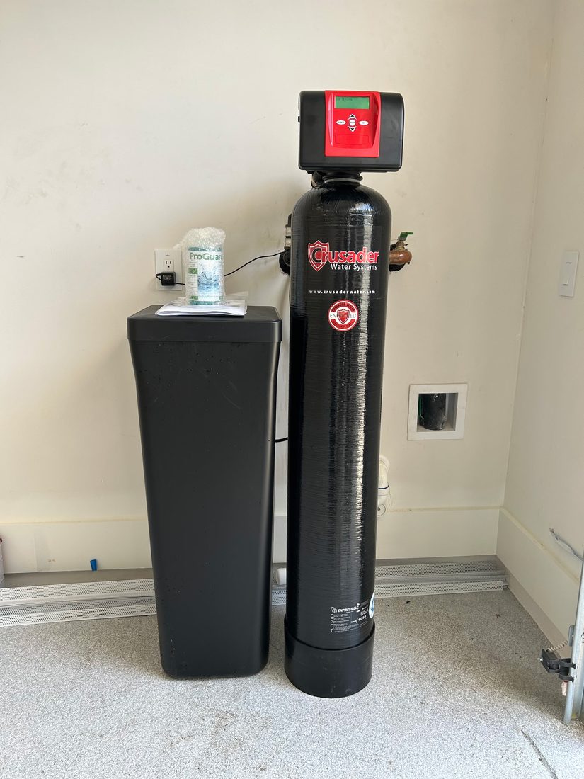 Crusader whole-home water system with owner’s manual and ProGuard maintenance kit