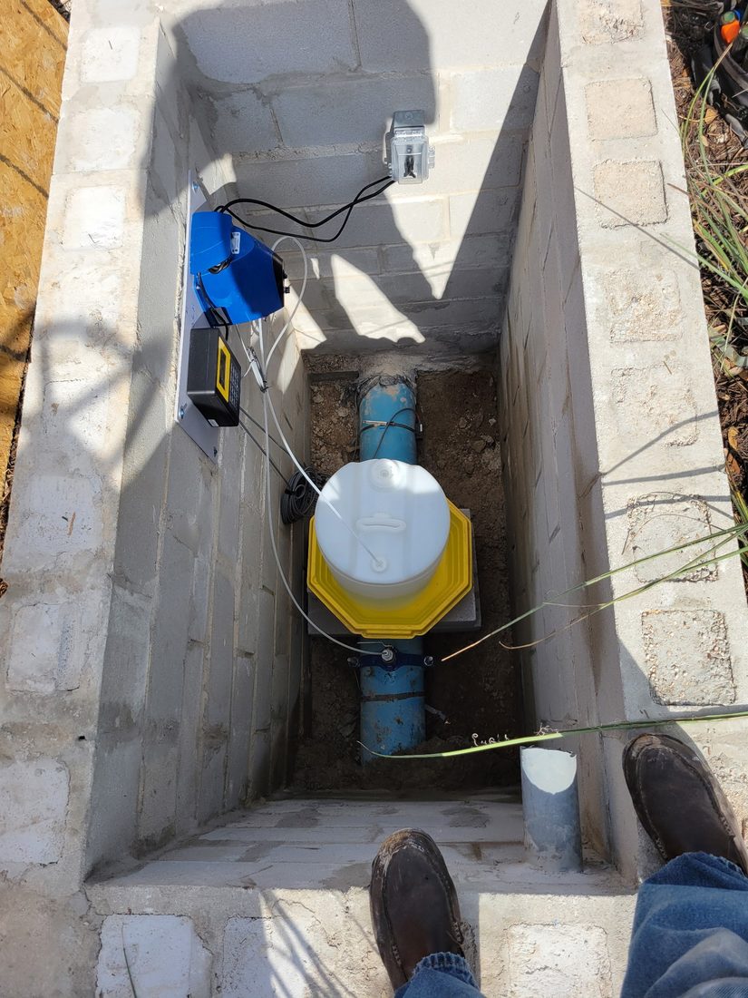 Well water treatment equipment installed in a Hill Country meter vault